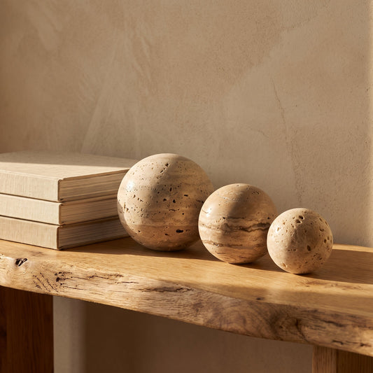 Tivoli™ Stone Spheres lined along an oak console in Calm Eden style