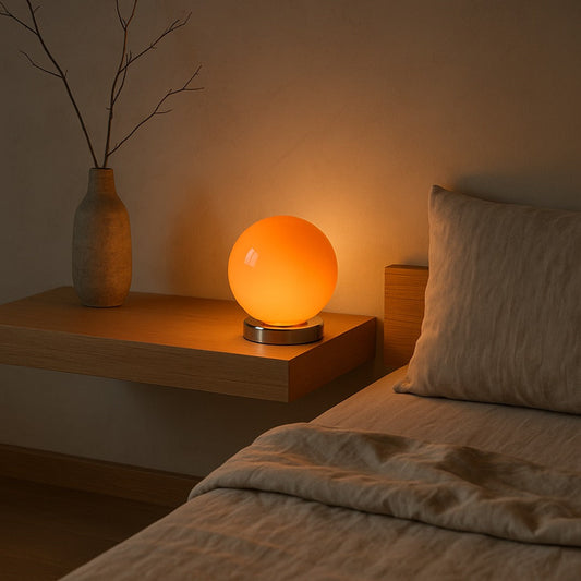 Ember lamp glowing on a floating oak nightstand at dusk
