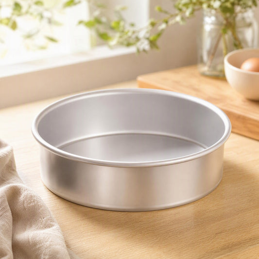 Liftbake™ Carbon Steel Removable Bottom Cake Mold in a calm home setting