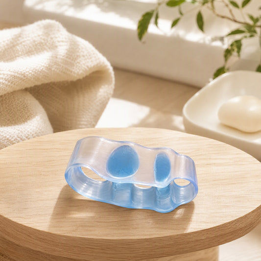 Toebloom™ Silicone Three-Hole Toe Separator in a calm home setting