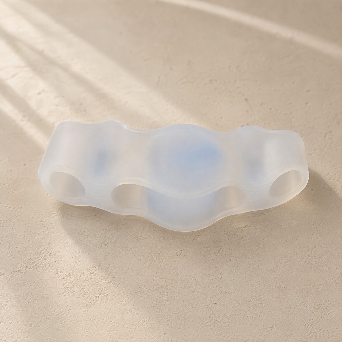 Toetriad™ Silicone Three-Hole Toe Separator, material and detail close-up
