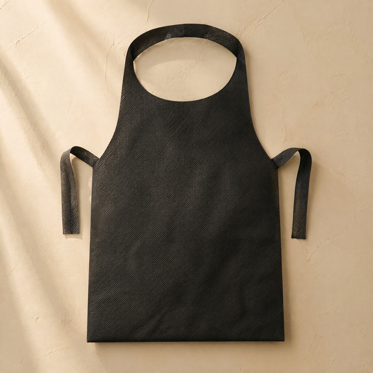 Quickbib™ Disposable Non-Woven Apron, material and detail close-up