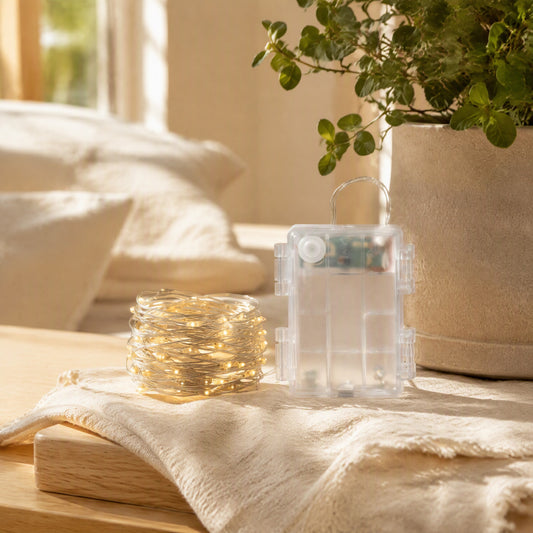 Lightweave™ 50-Light Copper Wire String Lights in a calm home setting