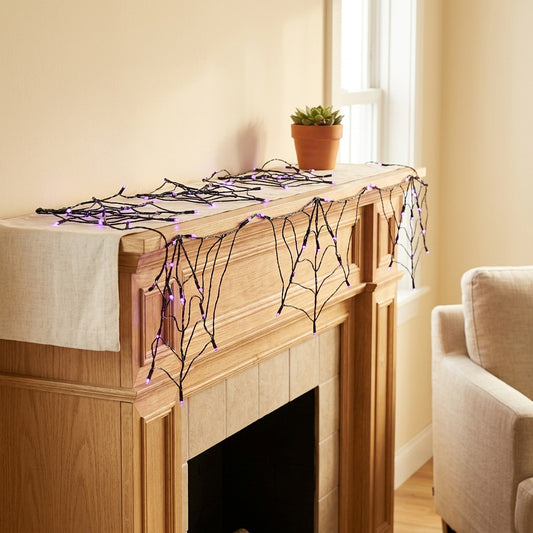 Webglow™ Halloween Spider Web String Lights in a calm home setting