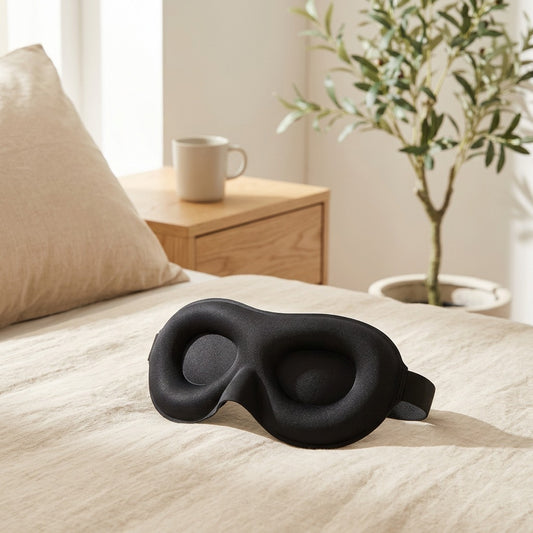 Dreemwell™ 3D Light-Blocking Sleep Mask in a calm home setting