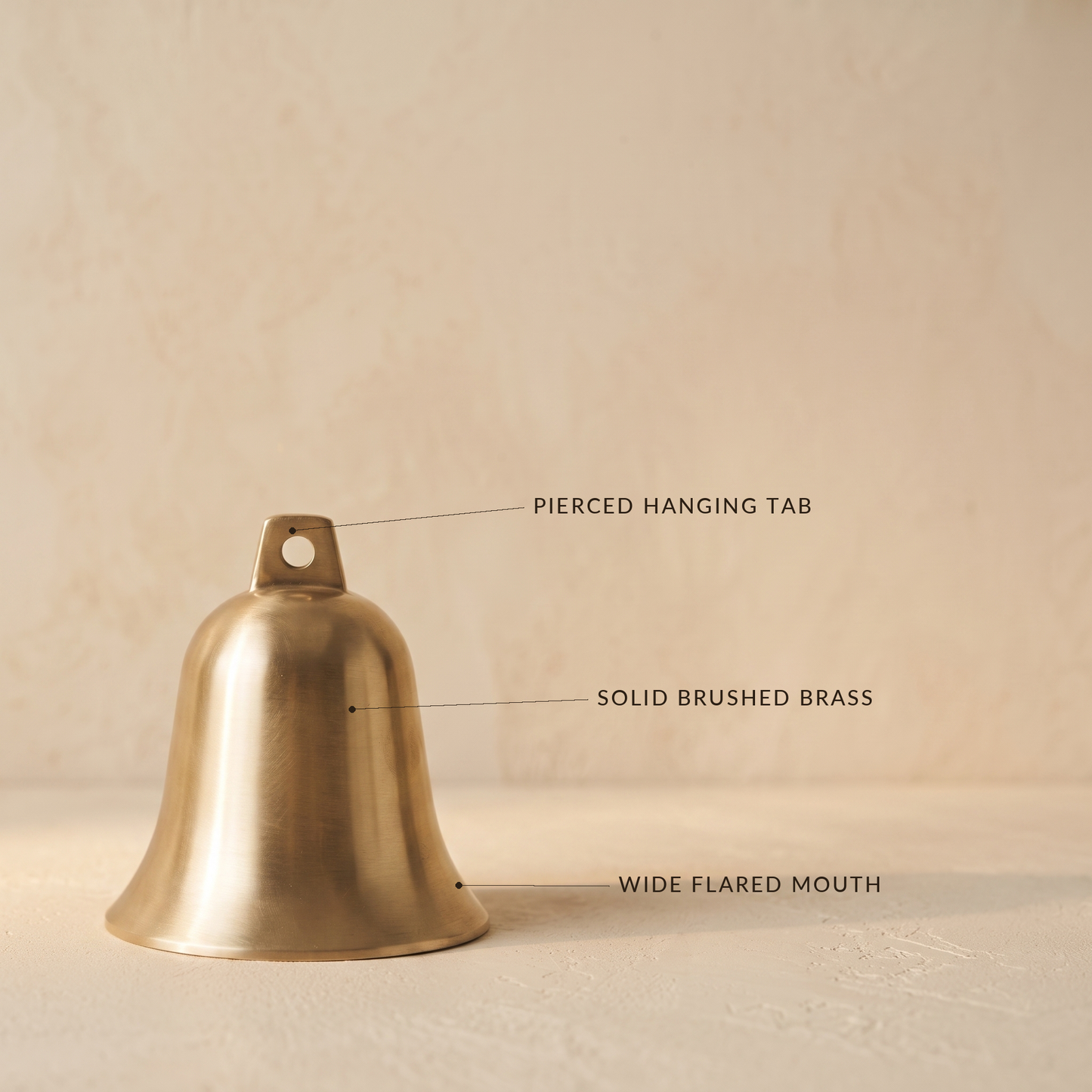 Vesper brass bell with labels for the pierced hanging tab, solid brushed brass body and wide flared mouth