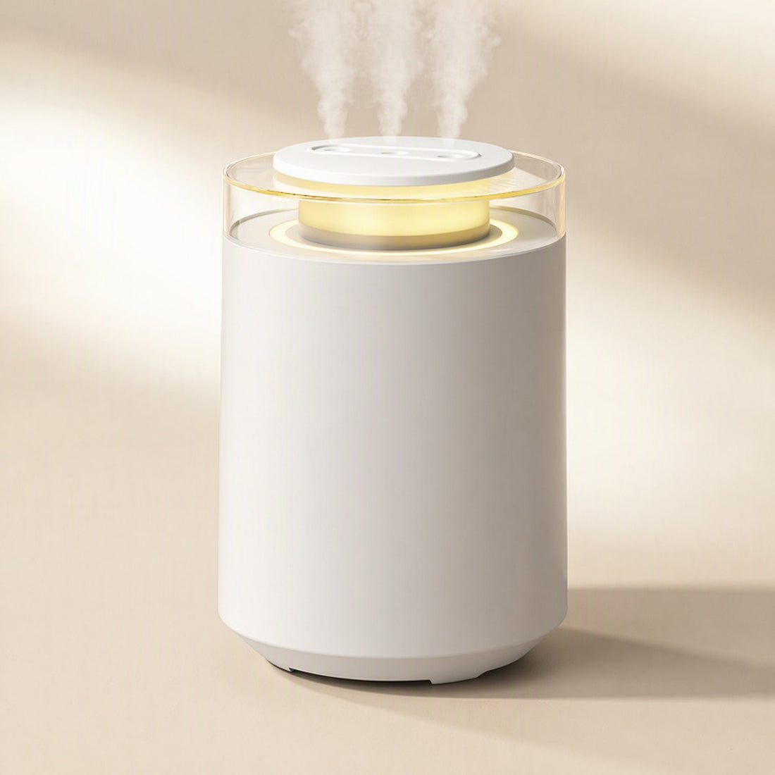 Column-shaped bedroom humidifier releasing mist with a warm glowing night light