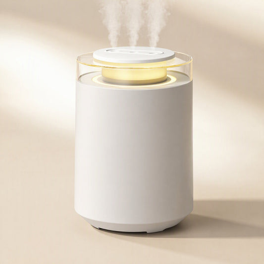 Column-shaped bedroom humidifier releasing mist with a warm glowing night light