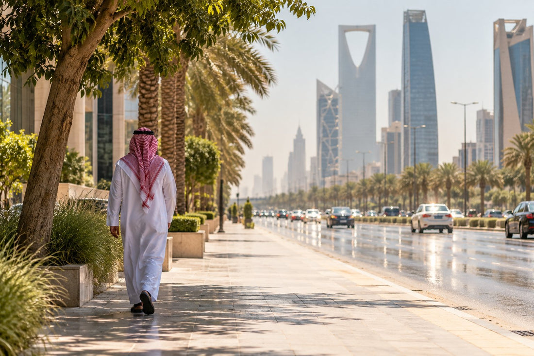 Sunlit Riyadh street at midday in summer with palm trees and glass towers in the heat haze