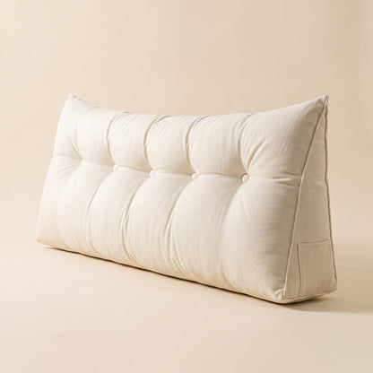 Lean™ Headboard Wedge Pillow — ivory tufted triangular wedge on warm cream background