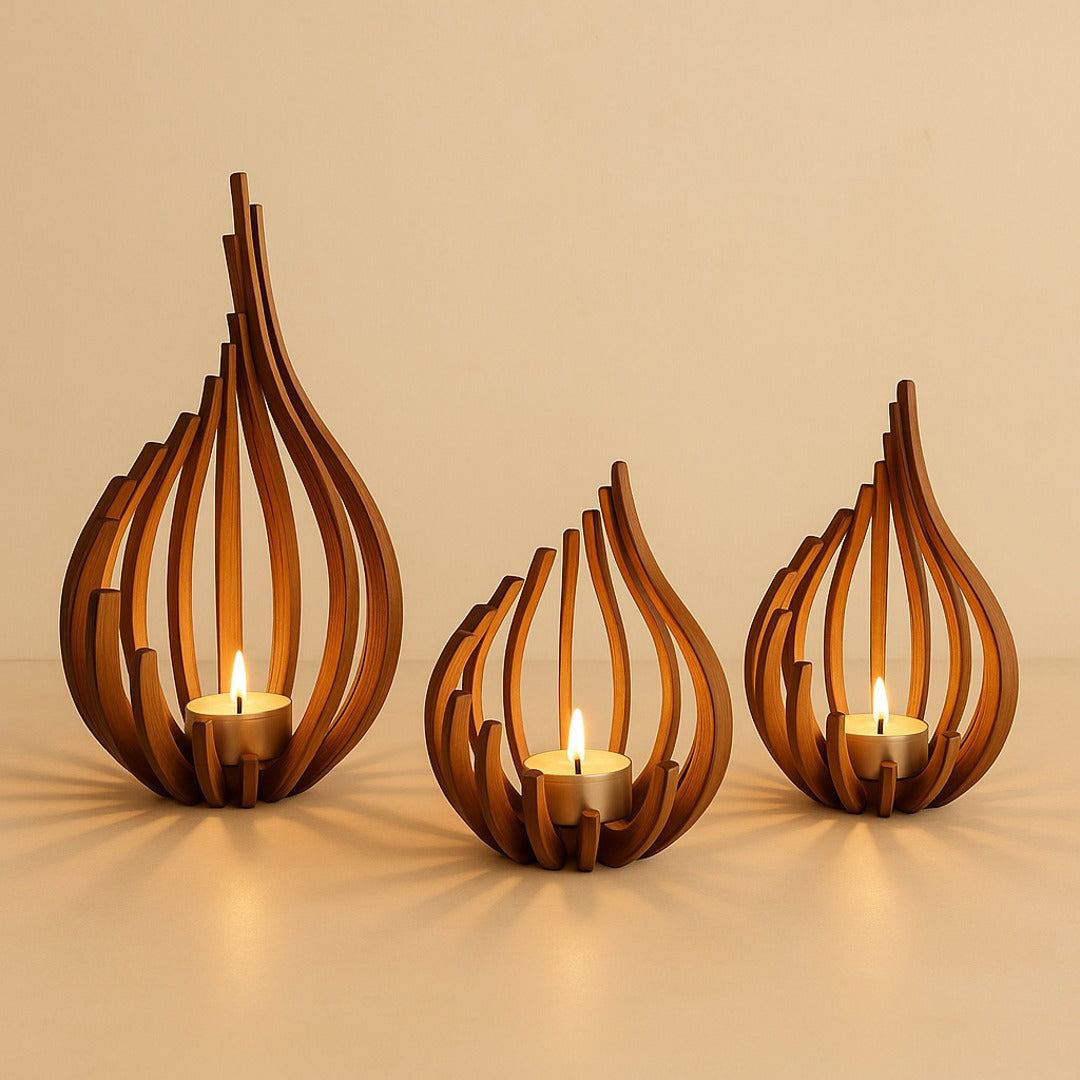 Flare wooden candle holders — three sizes lit on warm cream plaster