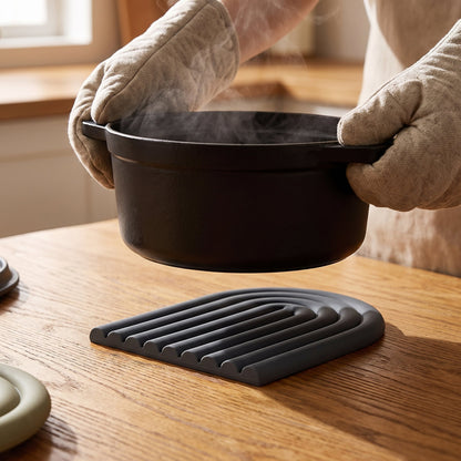 Setting a hot dutch oven onto the Vault™ Arch Trivet