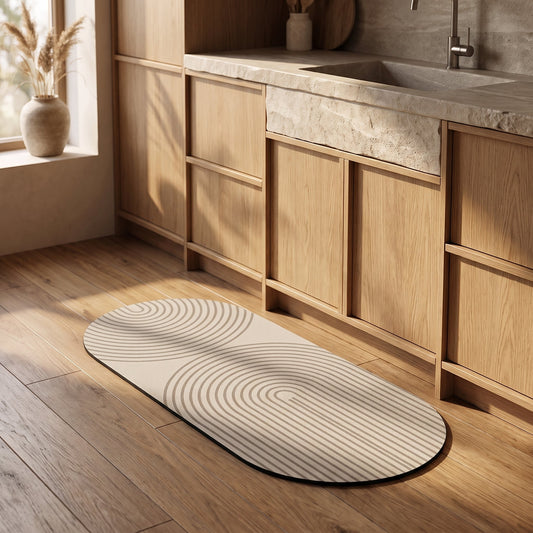 Stone™ Quick-Dry Kitchen Mat in front of the oak cabinetry in a warm Calm Eden-style kitchen