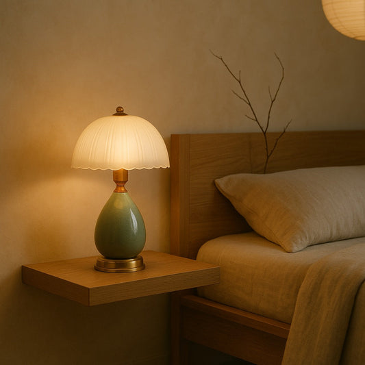 Petal lamp glowing on a floating oak nightstand beside a linen-dressed bed