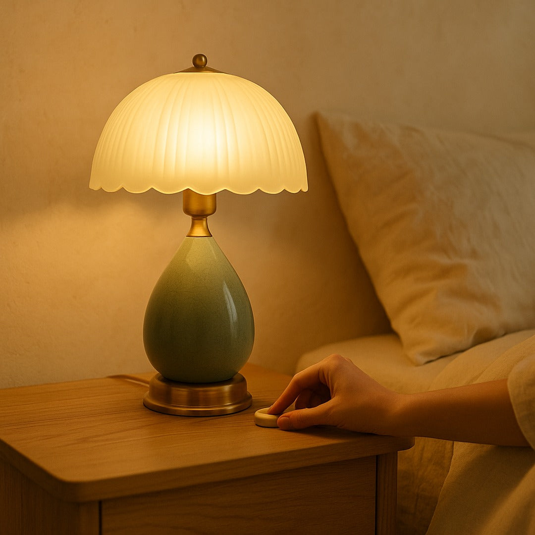 Hand pressing the cord switch to set Petal to its warmest glow