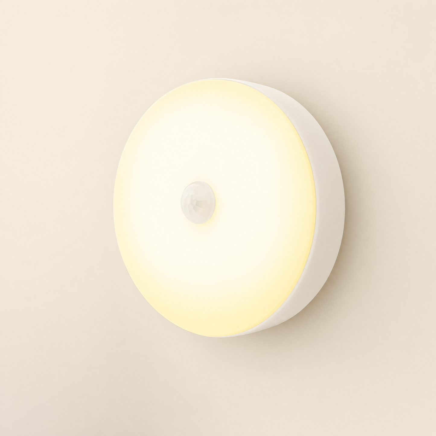 Halo motion night light glowing warm on cream backdrop