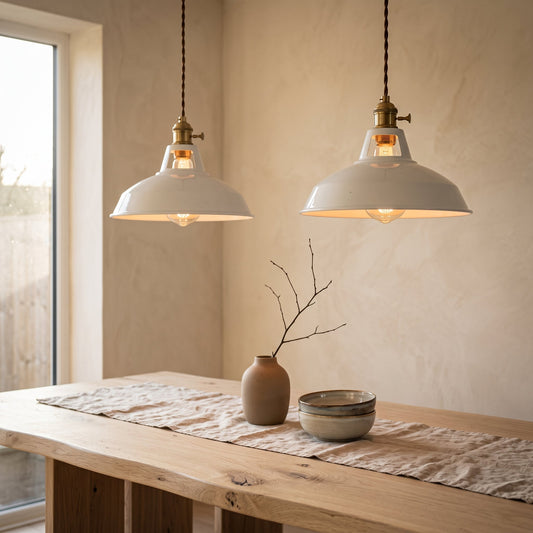 Two Brim Pendants hanging in a row above an oak dining table in a warm Japandi room
