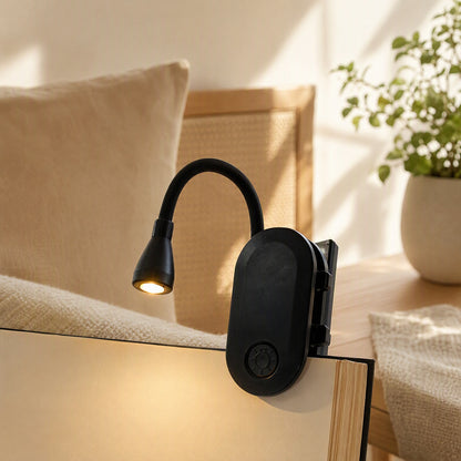 Pageglow™ Rechargeable LED Book Clip Night Light in a calm home setting