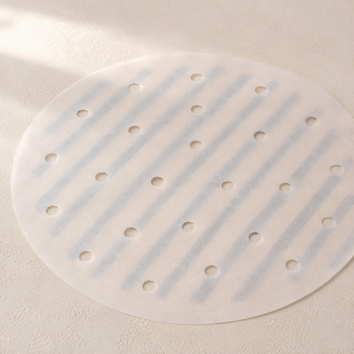 Crispring™ Round Air Fryer Parchment Paper, material and detail close-up