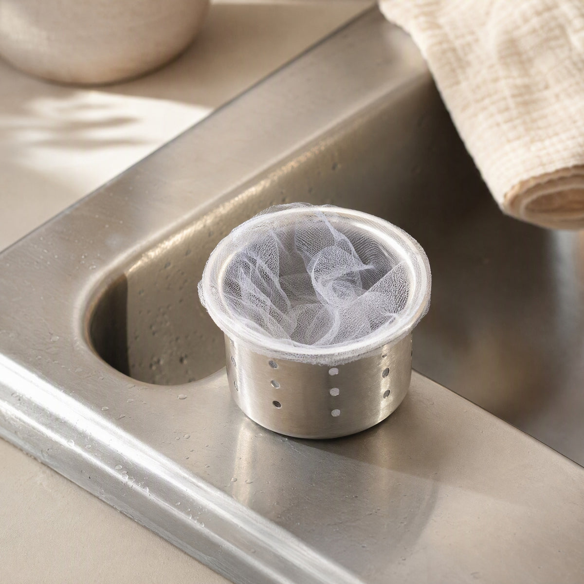 Drainveil™ Disposable Polyester Kitchen Sink Filter Net, styled close view