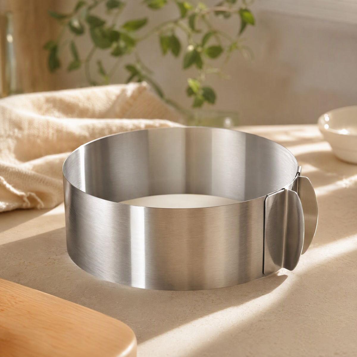 Ringform™ Stainless Steel Adjustable Cake Mold in a calm home setting