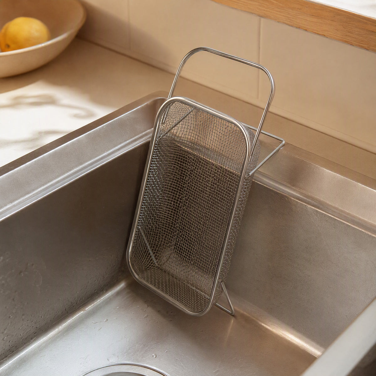Scrapcup™ Stainless Steel Sink Drain Basket, styled close view