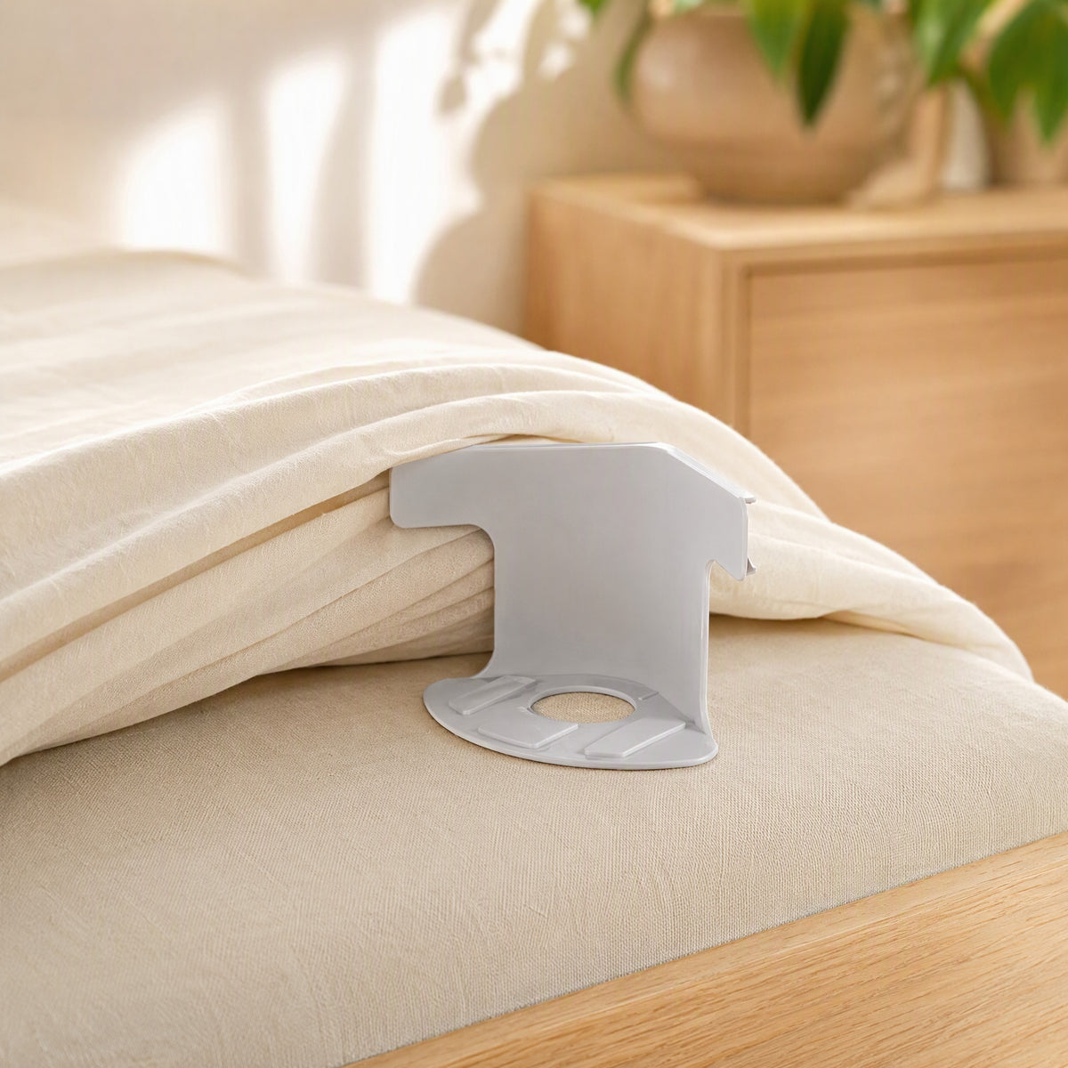 Hemhold™ Plastic Bed Sheet Clips in a calm home setting