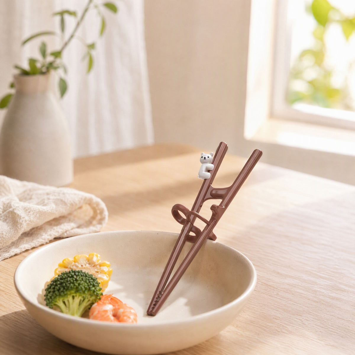 Pinchpath™ Plastic Training Chopsticks in a calm home setting