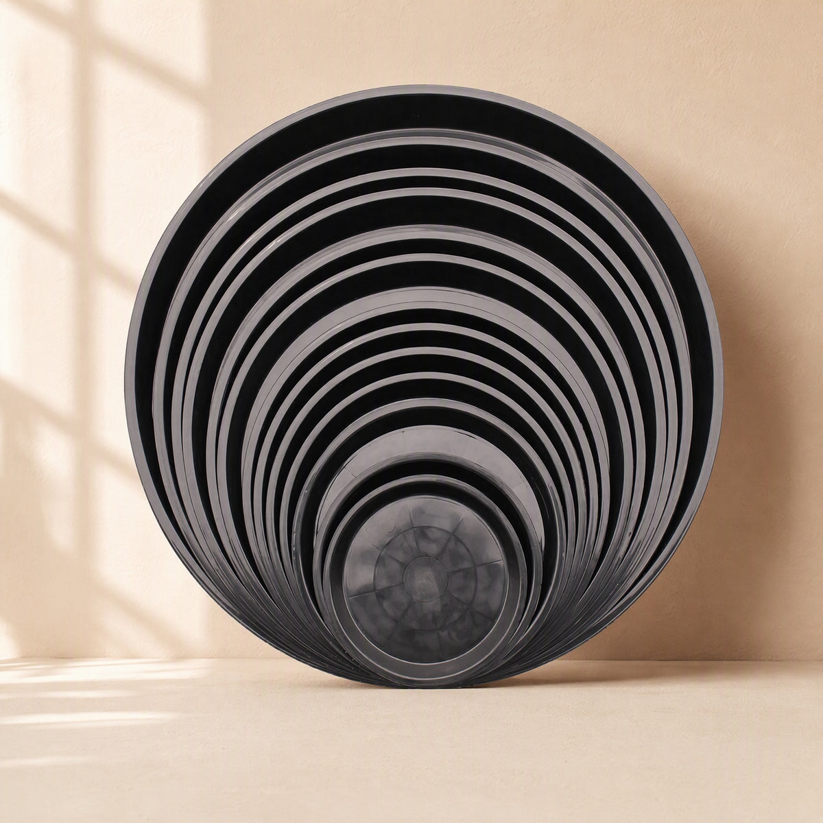Roundrest™ Round Black Plastic Flower Pot Tray