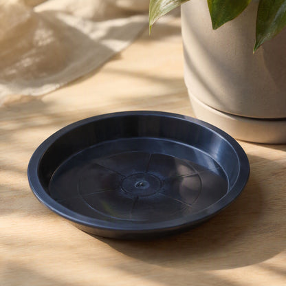 Roundrest™ Round Black Plastic Flower Pot Tray, styled close view