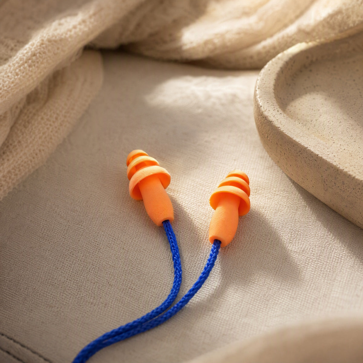 Wiremuffle™ Silicone Noise Reduction Earplugs With Wire, styled close view