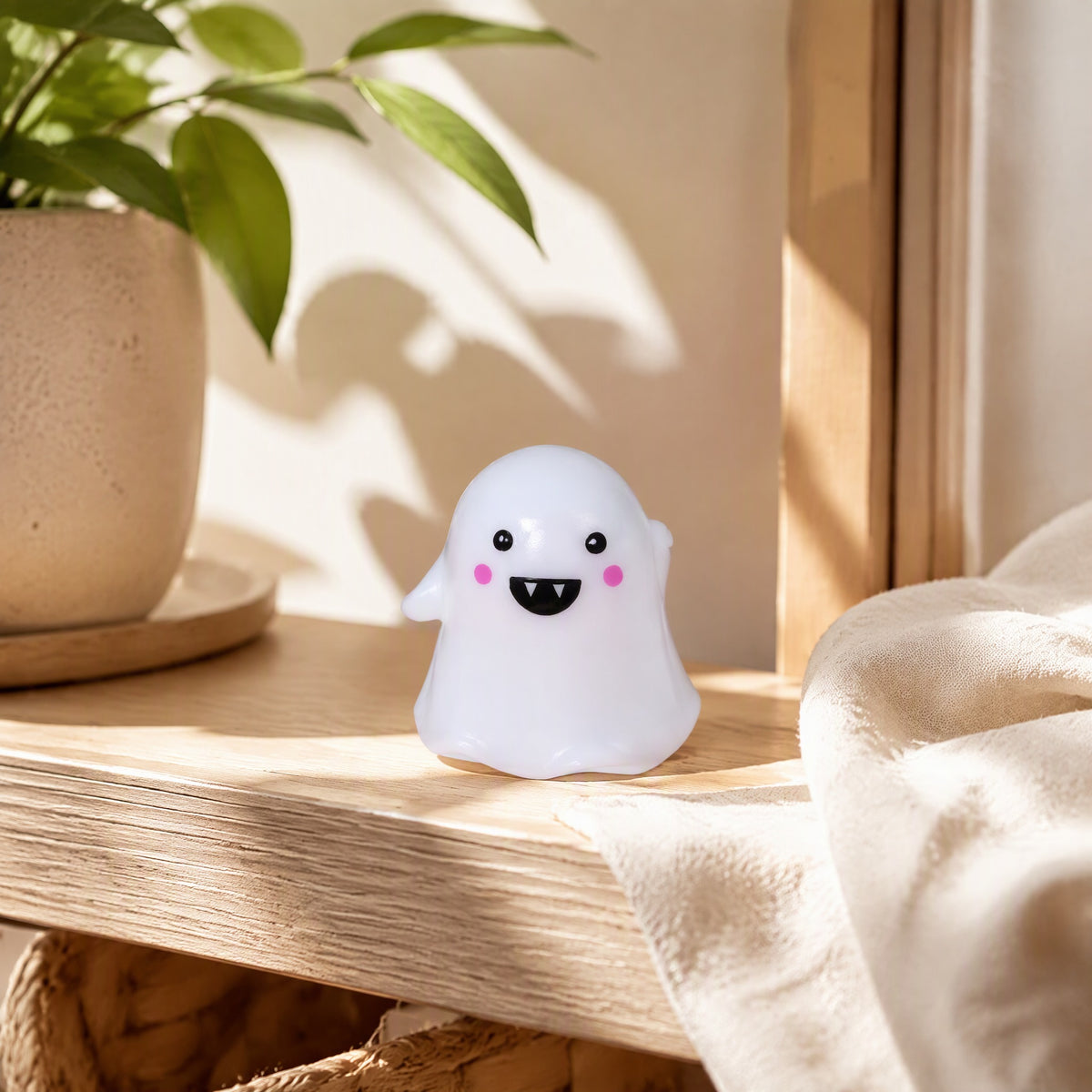 Spookglow™ Resin Ghost Party Decoration in a calm home setting