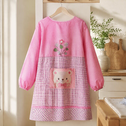 Cookcover™ Long-Sleeved Cartoon Kitchen Apron in a calm home setting