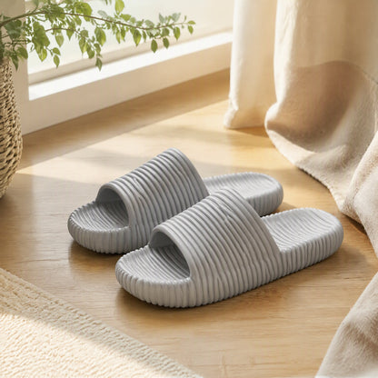 Floatstep™ EVA Striped Unisex Slippers in a calm home setting