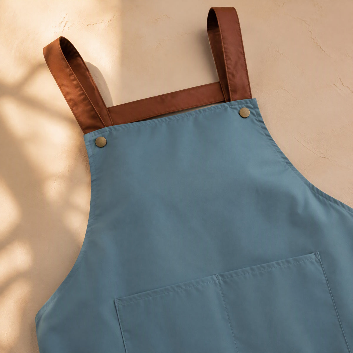Spillstash™ PVC Sleeveless Apron With Pockets, material and detail close-up