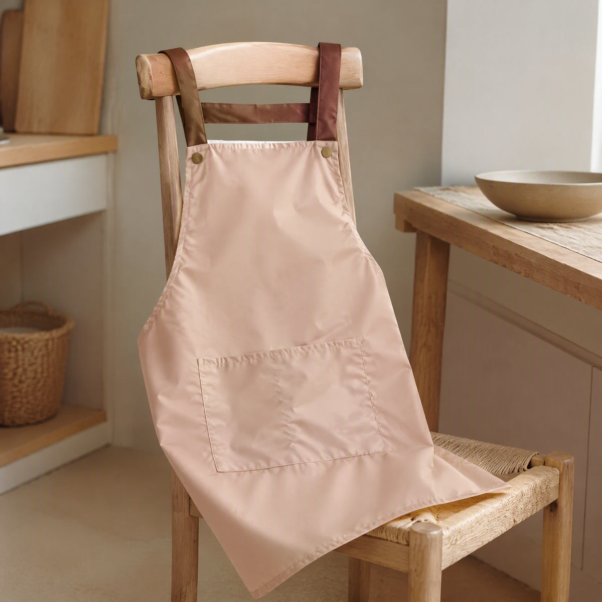 Spillstash™ PVC Sleeveless Apron With Pockets, styled close view