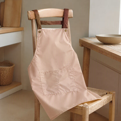Spillstash™ PVC Sleeveless Apron With Pockets, styled close view