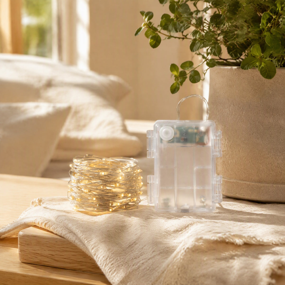 Lightweave™ 50-Light Copper Wire String Lights in a calm home setting