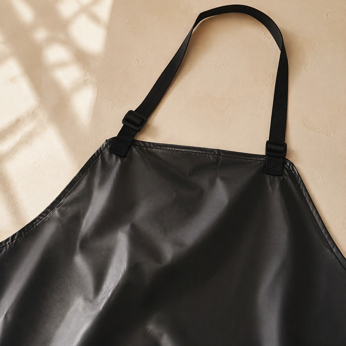 Splashguard™ PVC Waterproof Kitchen Apron, material and detail close-up