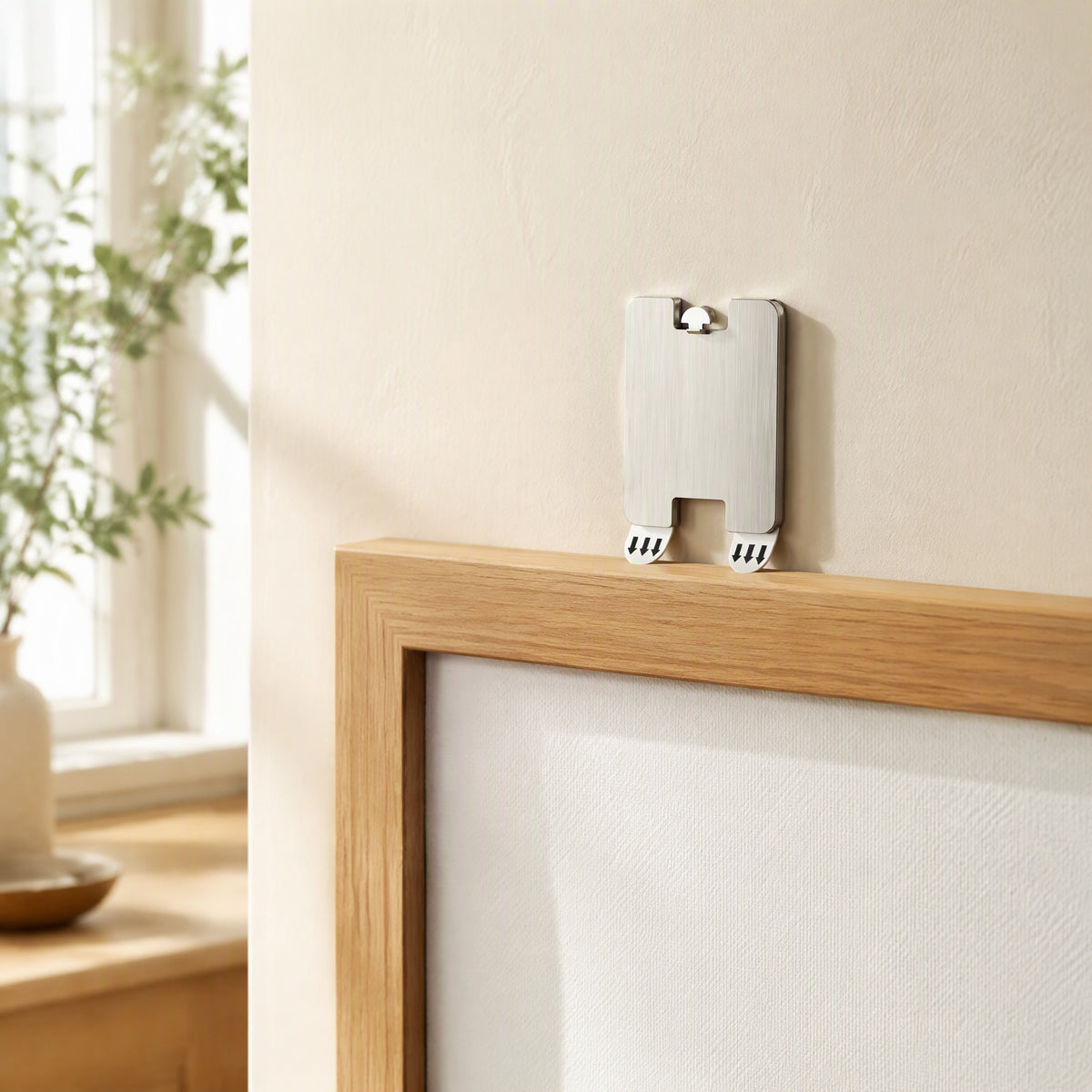 Wallpin™ Stainless Steel Picture Hanging Hooks in a calm home setting