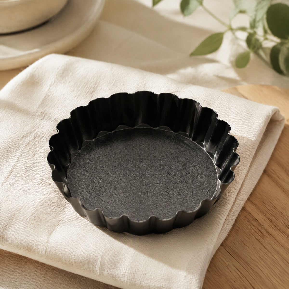 Roundbake™ Round Carbon Steel Cake Mold in a calm home setting