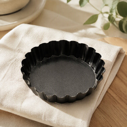Roundbake™ Round Carbon Steel Cake Mold in a calm home setting