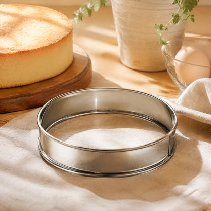 Steelbake™ Stainless Steel Round Cake Mold in a calm home setting