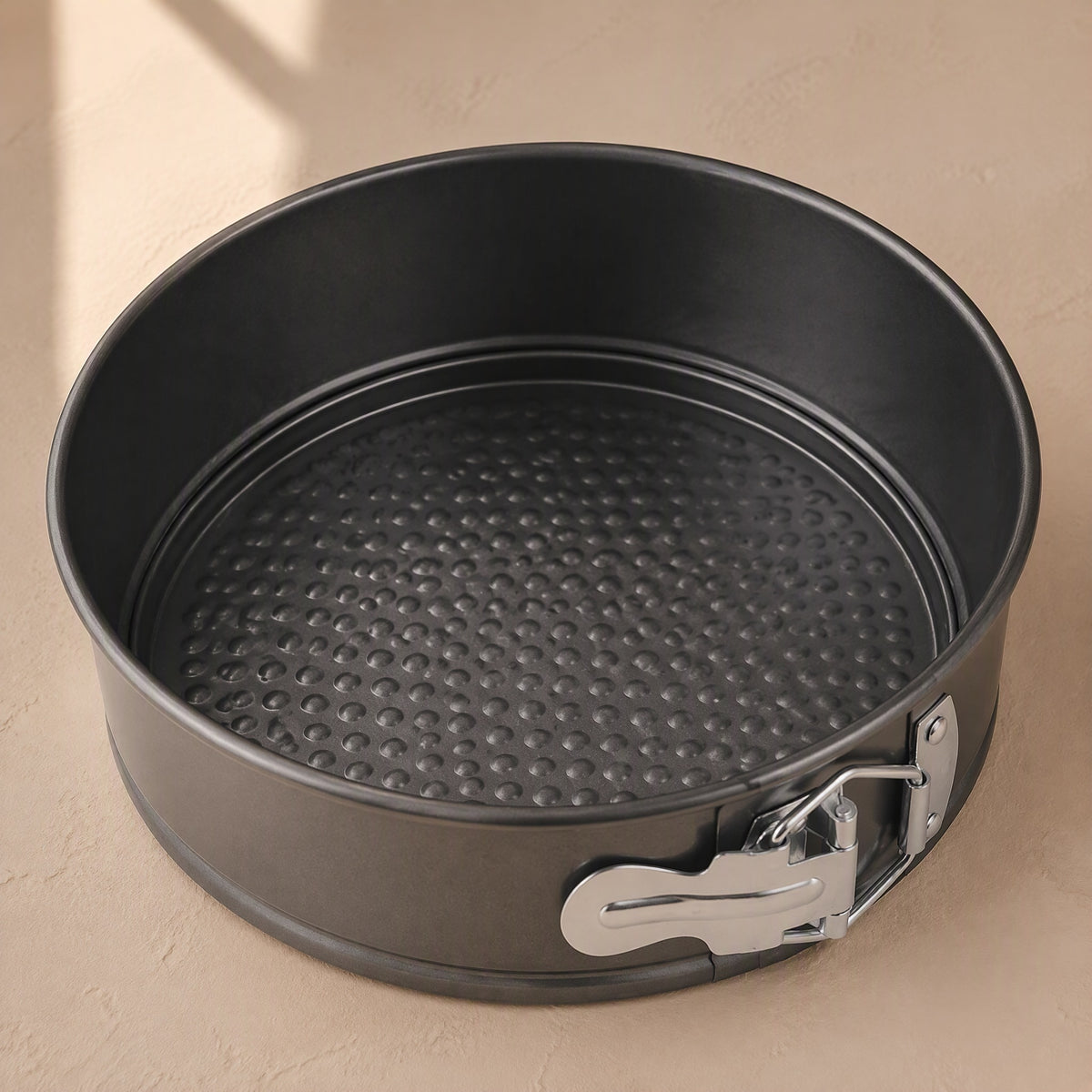 Moldsmith™ Carbon Steel Cake Mold, material and detail close-up