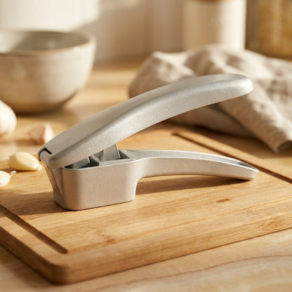 Squeezebulb™ Aluminum Alloy Garlic Press, styled close view