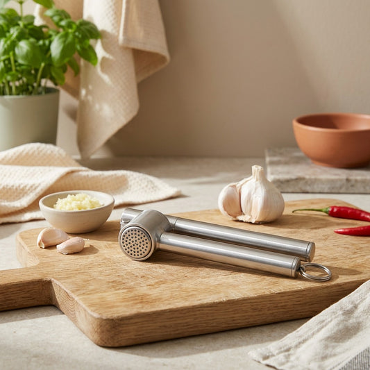 Pressclove™ Stainless Steel Garlic Press in a calm home setting