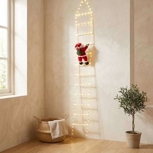 Clausglow™ Santa Claus Christmas Ladder Lights in a calm home setting