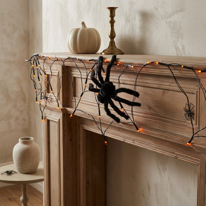 Webglow™ Halloween Spider Web String Lights, styled close view