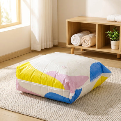 Packpress™ No-Pump Floral Compression Storage Bags in a calm home setting