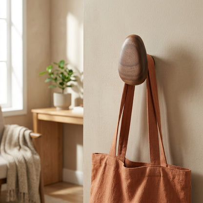 Pebblepeg™ Solid Wood Pebble Coat Hook in a calm home setting
